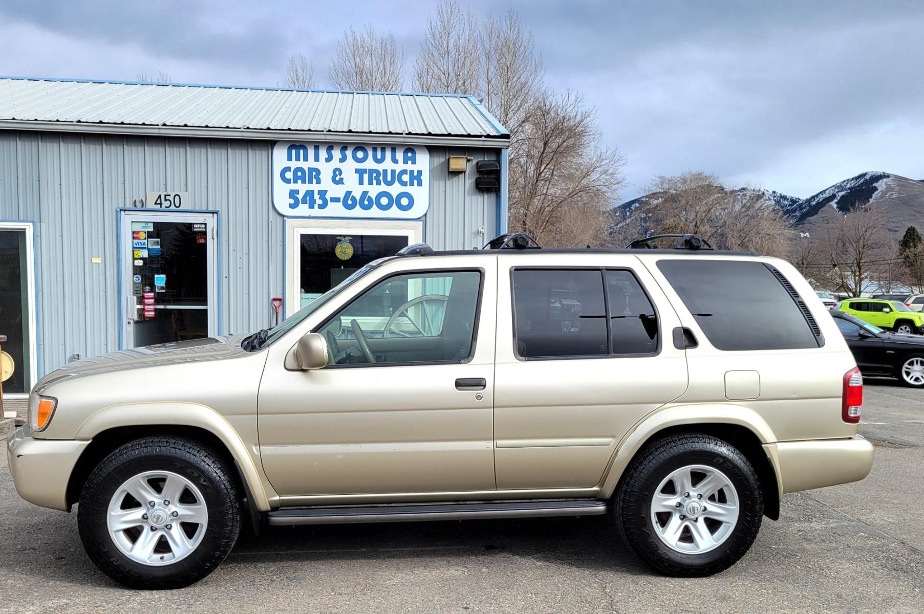 2002 Gold /Tan Nissan Pathfinder LE (JN8DR09Y22W) with an 3.5L v6 engine, Automatic transmission, located at 450 N Russell, Missoula, MT, 59801, (406) 543-6600, 46.874496, -114.017433 - 4WD SUV. 3.5L V6. Automatic Transmission. Heated Seats. Power Leather Seats. Power Sunroof. Air. Cruise. Tilt. AM FM CD Player. Power Windows and Locks. Because of the age, Financing is not available on this vehicle. - Photo #0